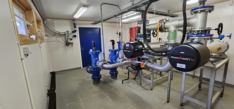 Construction of a water processing hut by a river